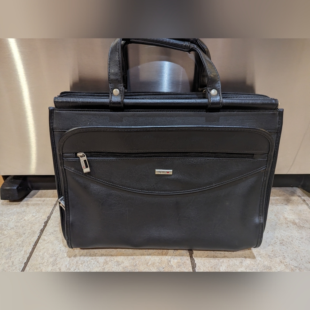 Solo brand black leather briefcase new never used. Missing shoulder strap.